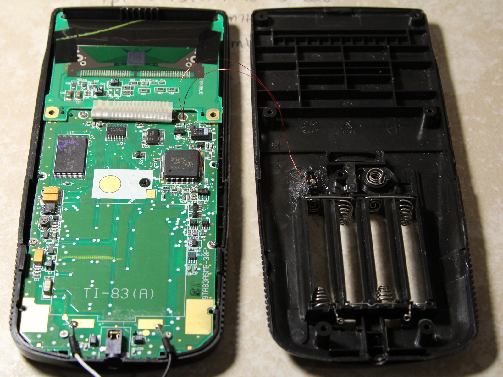 The TI-83+ case doesn't leave much room, but there is just enough space for a small switch to be added in the battery compartment.